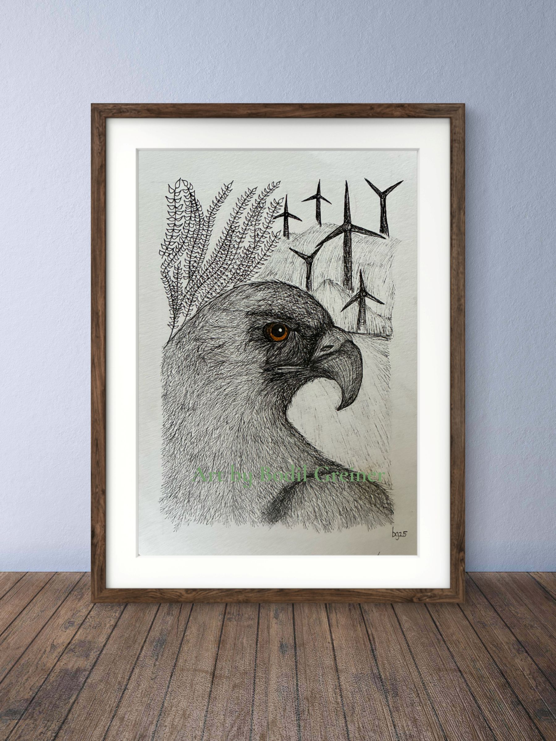 Framed original miniature fineliner eagle art hanging on a living room wall